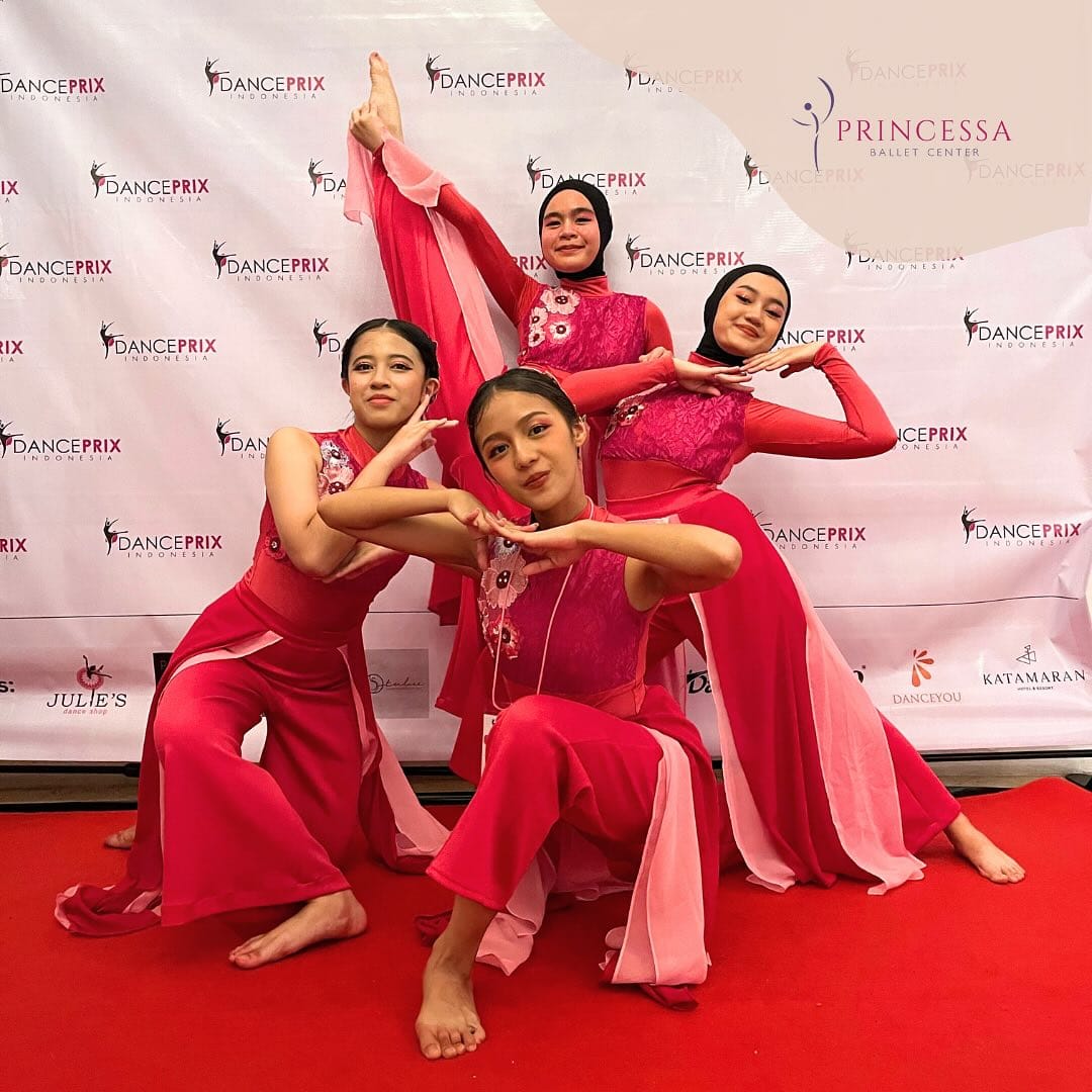 Contemporary group in red costumes